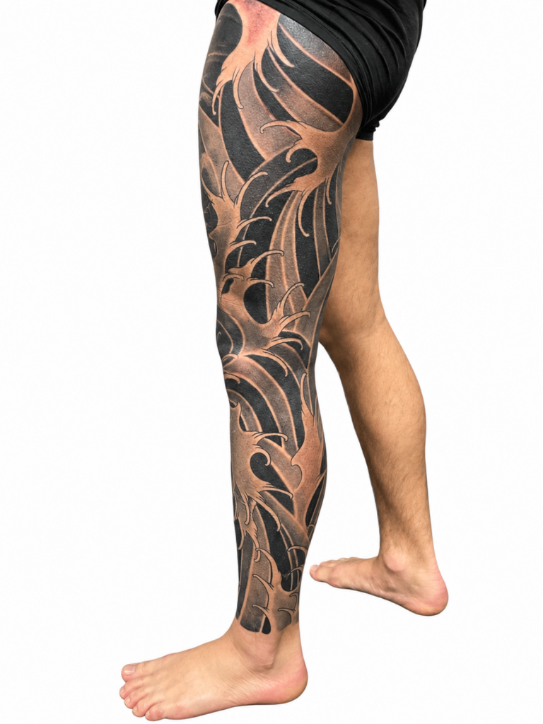 Black and grey Japanese leg sleeve tattoo, Australia